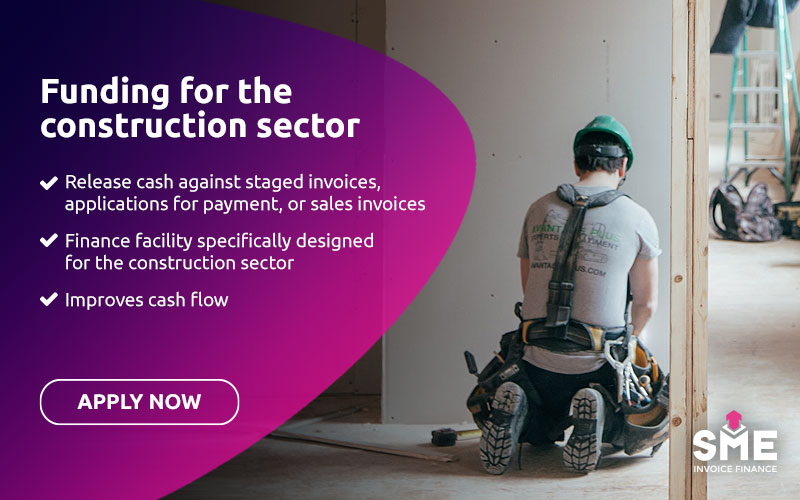Funding for the construction sector - Worker on construction site fixing plasterboard on walls and ceiling
