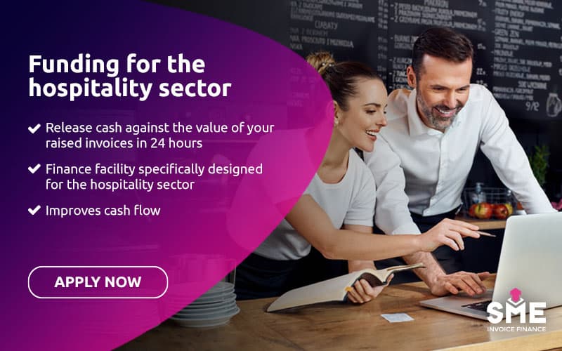 Hospitality business owners reviewing accounts and outstanding business invoices on a laptop.