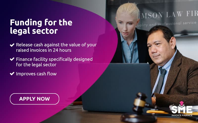 Legal firm owners reviewing accounts and outstanding business invoices on a laptop.